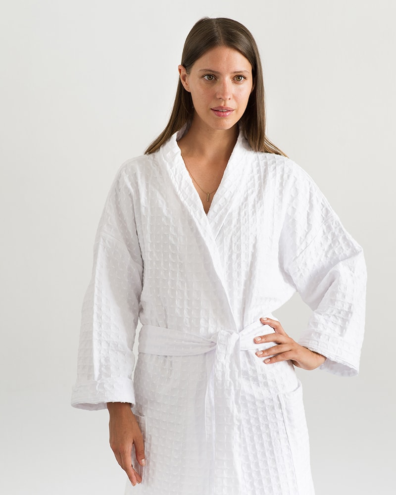 Woman posing in an all natural fibre Mungo Kamma Cotton Gown in textural White Lattice weave